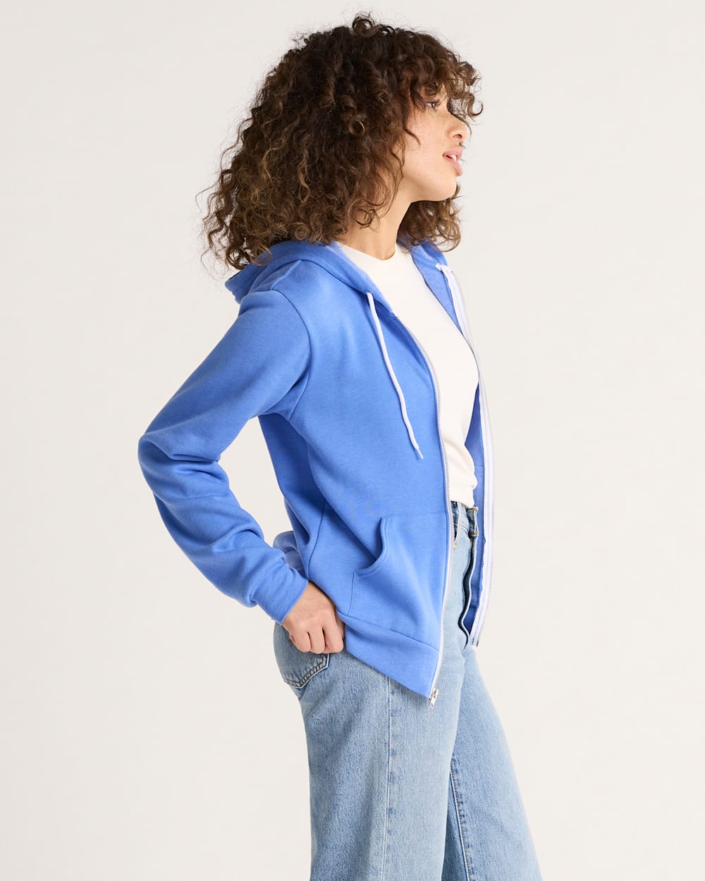 SIDE VIEW OF WOMEN'S HARDING GRAPHIC ZIP HOODIE IN BLUE HEATHER image number 3