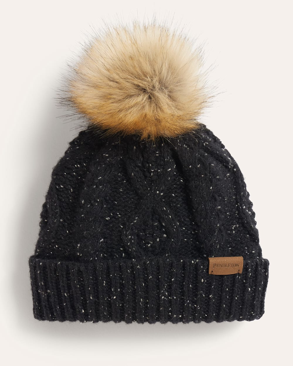 CABLE KNIT POM BEANIE IN BLACK DONEGAL image number 1