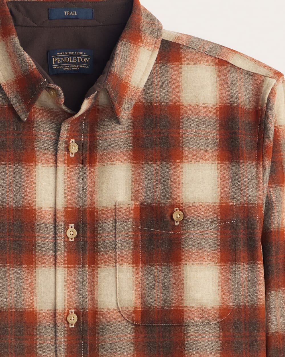 CLOES UP VIEW OF MEN'S PLAID ELBOW-PATCH TRAIL SHIRT IN RUST/WHITE PLAID image number 2