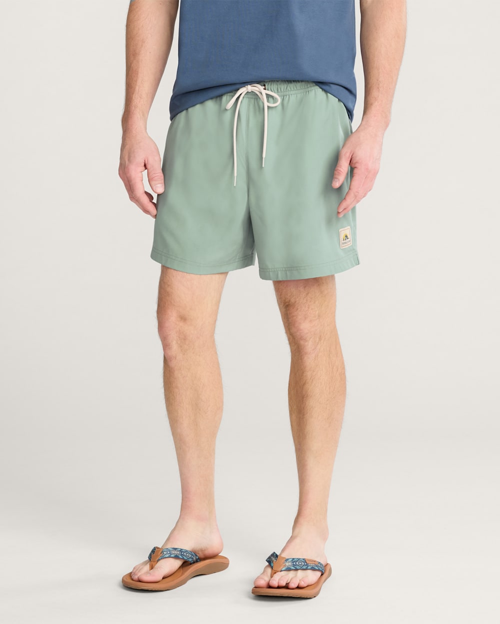 TROPICAL HYDROMORPH SWIM TRUNKS IN CHINOIS GREEN image number 1