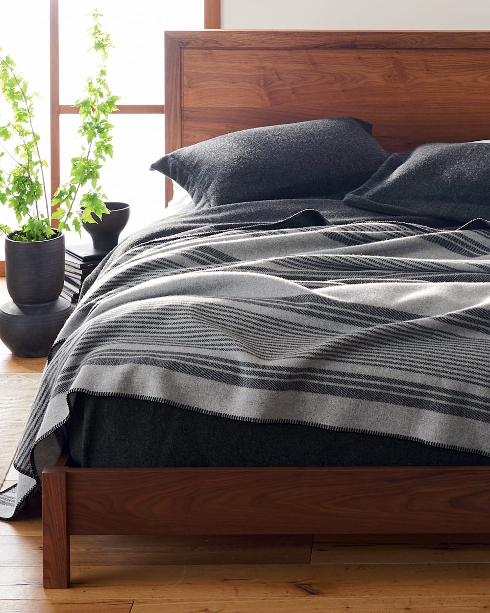 ECO-WISE WOOL PLAID/STRIPE BLANKET IN GREY IRVING STRIPE SHOWN ON BED image number 3