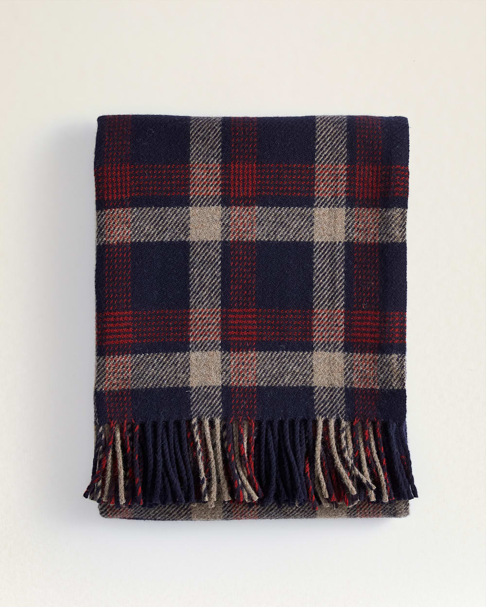 FOLDED VIEW OF ECO-WISE WOOL FRINGED THROW IN NAVY KELSO PLAID image number 1