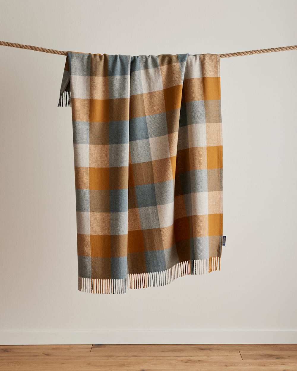 HANGING VIEW OF ECO-WISE WOOL FRINGED THROW IN SHALE/COPPER image number 4