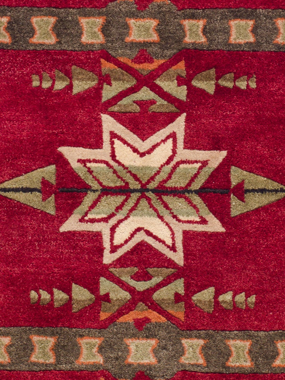 CLOSE UP OF HANDMADE GATEKEEPER RUG IN RED image number 2