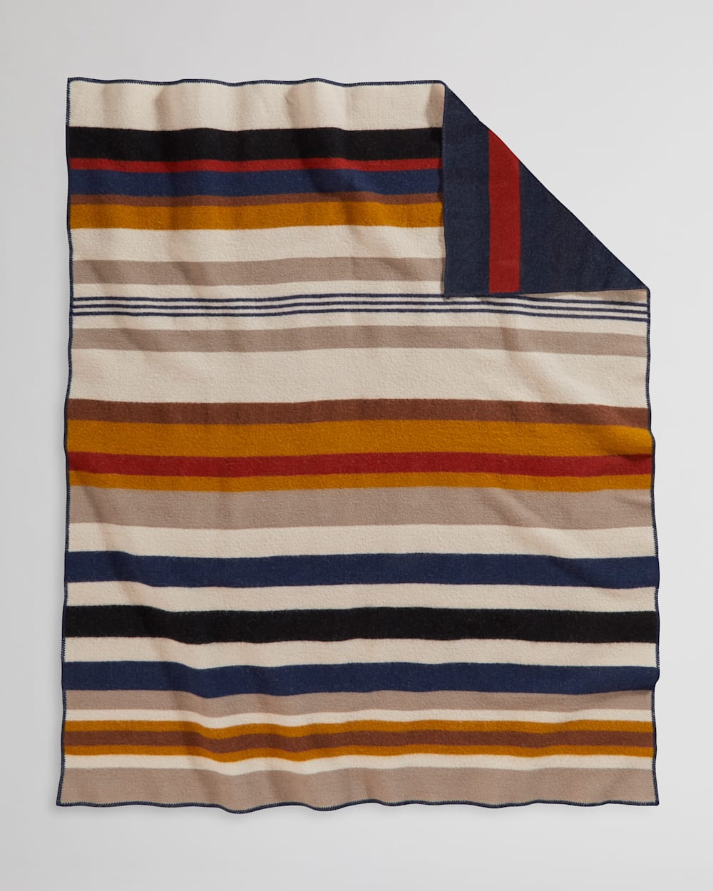 ALTERNATE VIEW OF BRIDGER WOOL THROW WITH CARRIER IN NAVY CASCADE STRIPE image number 4