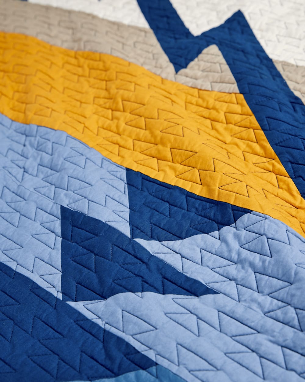 ALTERNATE VIEW OF TRAPPER PEAK PIECED QUILT SET IN BLUE/GOLD image number 2