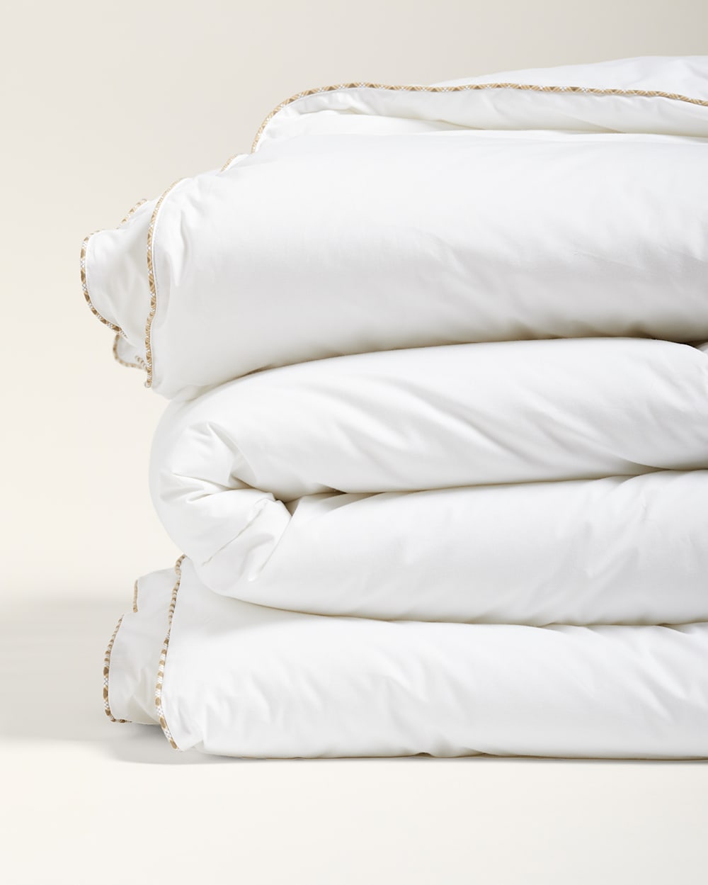 CLOSE UP FOLDED VIEW OF DOWN ALTERNATIVE COMFORTER IN WHITE image number 4