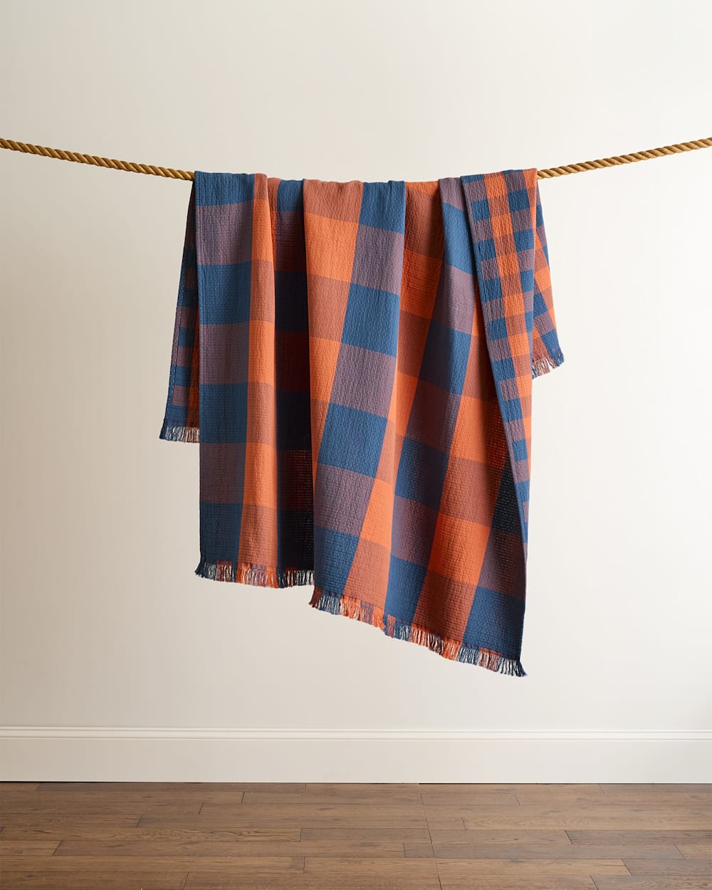 BLOCK PLAID ORGANIC COTTON FRINGED THROW IN COPPER/INDIGO image number 1