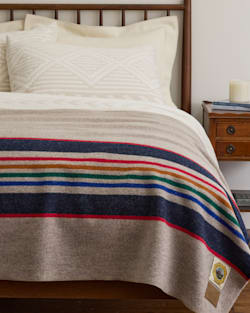 YELLOWSTONE NATIONAL PARK BLANKET IN TAUPE ON A BED image number 5