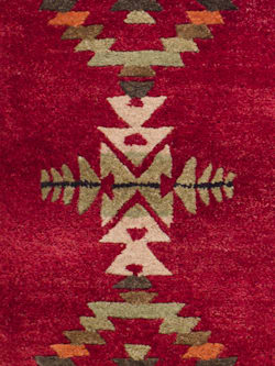 CLOSE UP OF HANDMADE GATEKEEPER RUG IN RED image number 3
