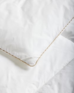 CLOSE UP VIEW OF DOWN ALTERNATIVE COMFORTER IN WHITE image number 3